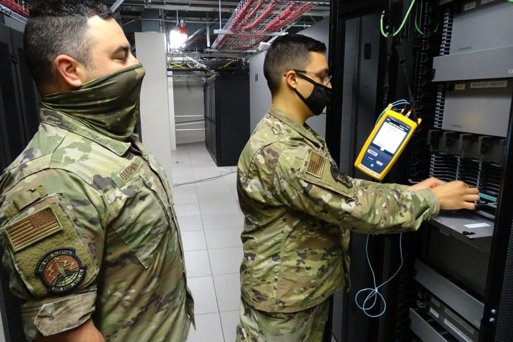 technician splicing fibre optic cables